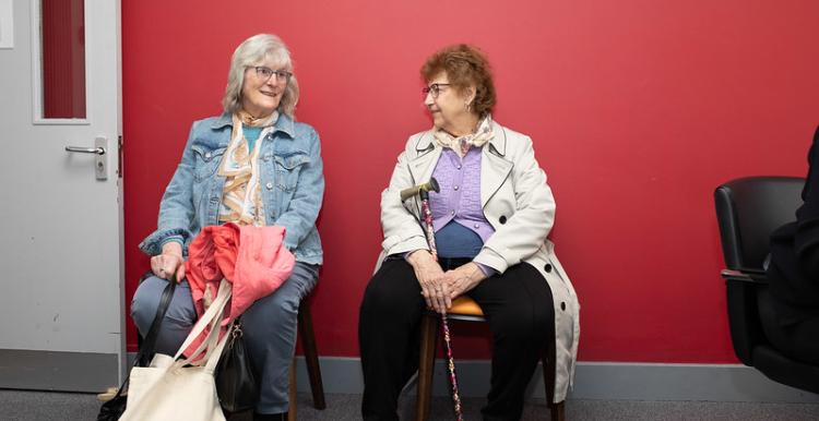 Two women sitting in a waiting room