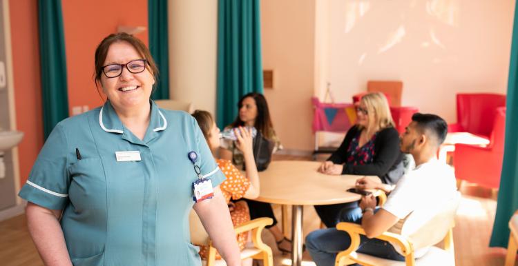 A nurse smiling in a care home