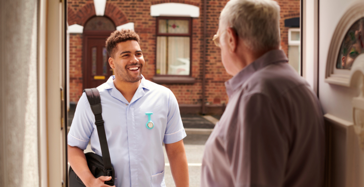 Care worker with elderly man