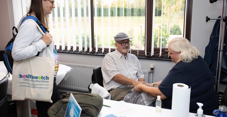People talking at a Healthwatch event