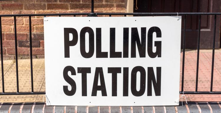 Sign reading 'polling station'