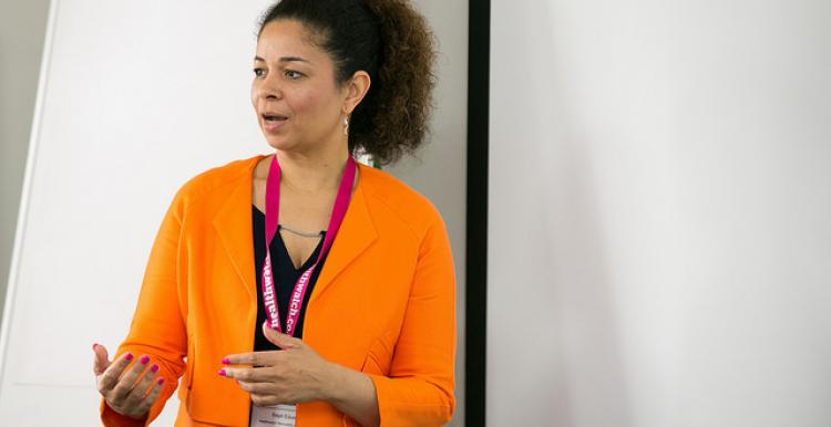 Staff member talking to a crowd