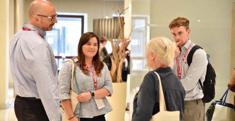 Group of people chatting before an event