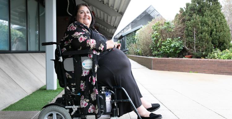 Wheelchair user outside building