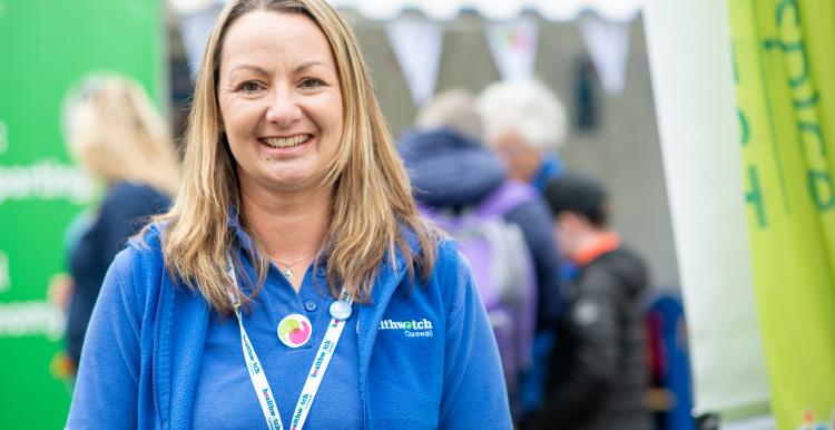 A Healthwatch Cornwall volunteer smiling at the camera