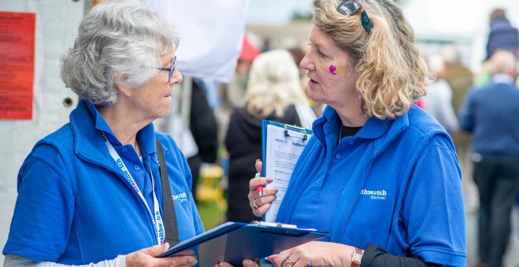 Two women and a clipboard Two women and a clipboard