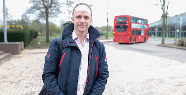 Man by a bus