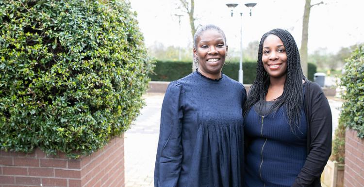 Two women smiling