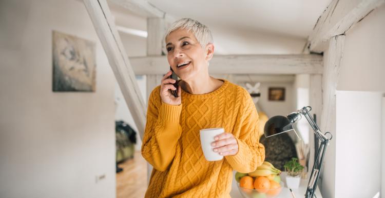 Woman with short blonde hair on the phone