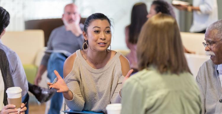 Woman discusses ideas during meeting