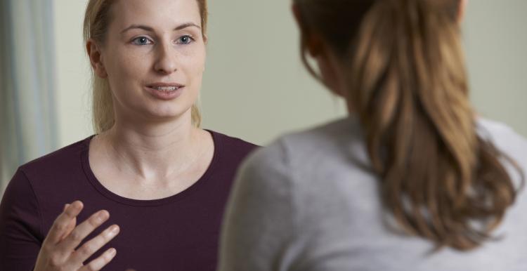 Two women talking.