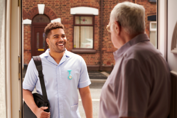 Care worker with elderly man