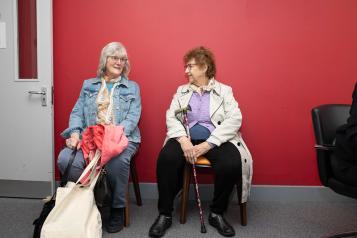 Two women sitting in a waiting room