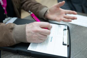 information collection form being completed on a notepad