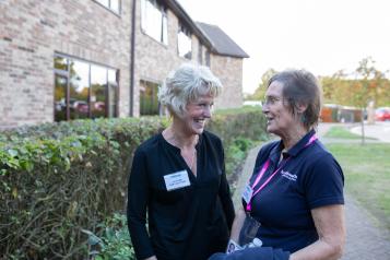 Healthwatch representative and volunteer in discussion 