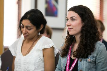Two women at Healthwatch conference learning