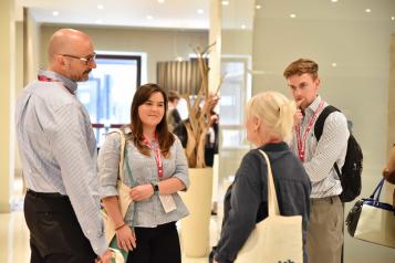 Group of people chatting before an event