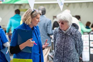 Two women talking at a county show