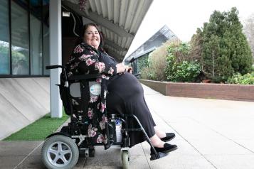 Wheelchair user outside building