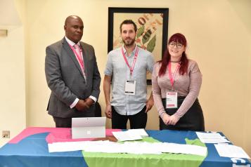 Three people from the healthwatch network smiling. 