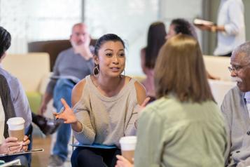 Woman discusses ideas during meeting
