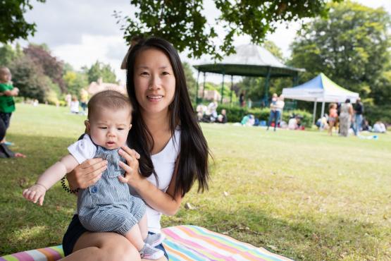Woman and baby in a park